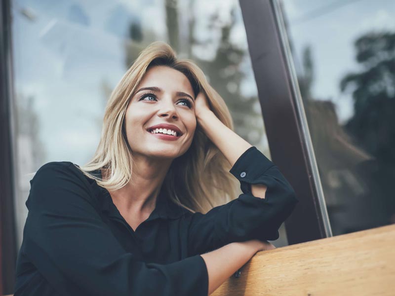 Natural smile with dental implant and cleaning results in Mesa, AZ