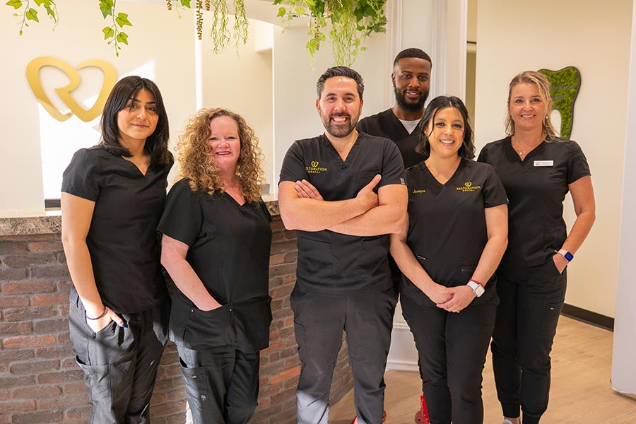 Dentist performing teeth whitening procedure in Mesa, AZ