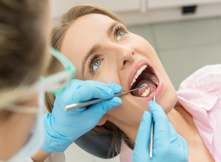 Dental hygienist performing professional teeth cleaning for oral health in Mesa, AZ