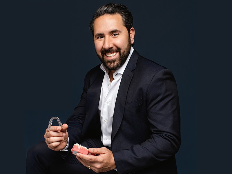 Dr. Fadi holding Invisalign in Mesa, AZ